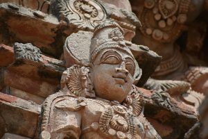 Close-up of a detailed Hindu sculpture at a temple in Thanjavur, India showcasing religious art.