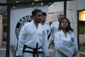 A group of martial arts students practicing in a Buenos Aires dojo.