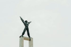 Minimalist photo of the iconic Tugu Selamat Datang monument against a clear sky in Jakarta.