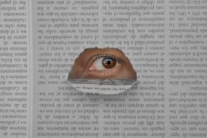 Artistic image of an eye peering through a hole in a newspaper, symbolizing insight and observation.