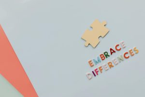 Colorful letters and puzzle piece promoting diversity and inclusion.