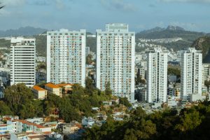 Skyline view of Ha Long with modern high-rise apartment buildings and lush greenery.