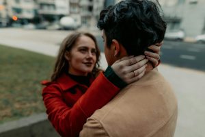 A young couple engaged in an intimate embrace on the streets of Buenos Aires, Argentina.