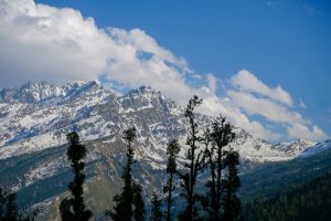 Captivating view of the snow-covered Himalayan peaks at Salud Dugra, Uttarakhand, India.