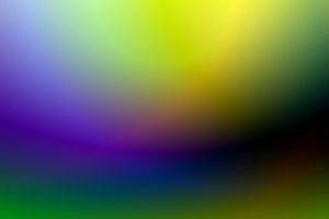 A dynamic and colorful gradient background blending green, purple, and yellow hues.