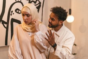 A couple having a disagreement indoors, showcasing emotions and relationship dynamics.