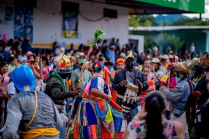 Vibrant street festival showcasing traditional dance and colorful costumes, creating an atmosphere of cultural celebration.