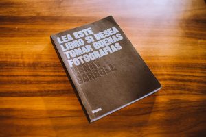 Photography guidebook displayed on a wooden table, highlighting its cover design.