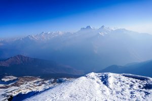 Breathtaking view of snow-covered Himalayan mountains in Salud Dugra, Uttarakhand, India.