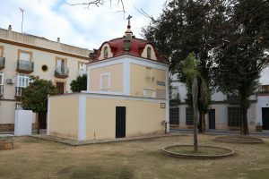 Charming historic building with unique architectural style in Puerto Real, Spain, surrounded by a quaint urban setting.