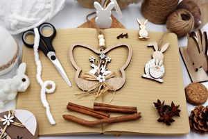 Rustic Easter decor with natural materials, featuring wooden ornaments and notebook.