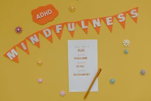 Creative poster promoting ADHD awareness and mindfulness practices.